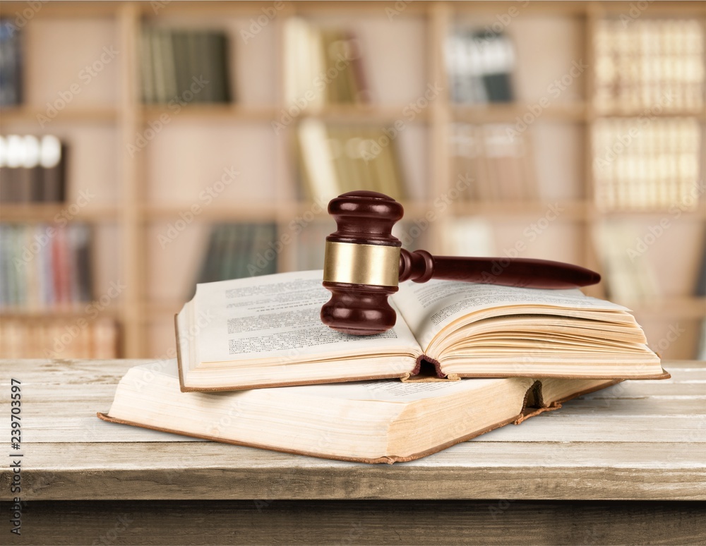 Books and wooden gavel on table. Justice concept Books and wooden gavel on table. Justice concept