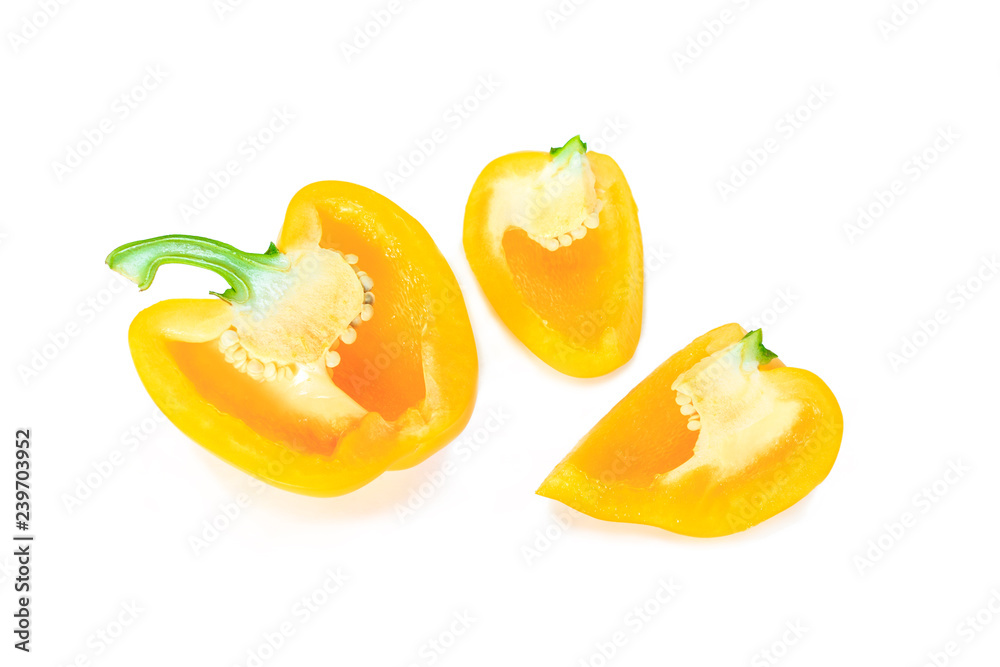yellow bell pepper cut into pieces on white background.