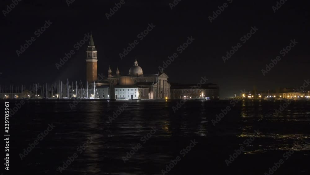 Venice night time lapse of boat traffic with San Giorgio Maggiore church in the background Venice night time lapse of boat traffic with San Giorgio Maggiore church in the background