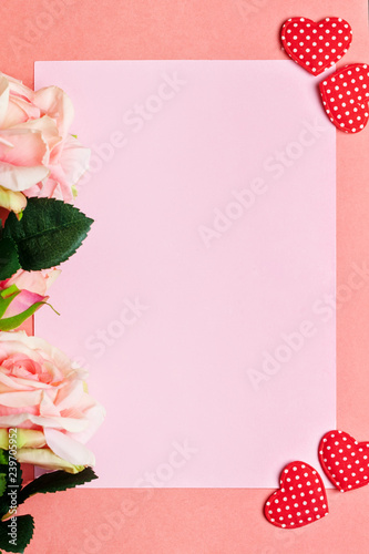 Greeting card on coral background. Selective focus. Vertical. Background with copy space.