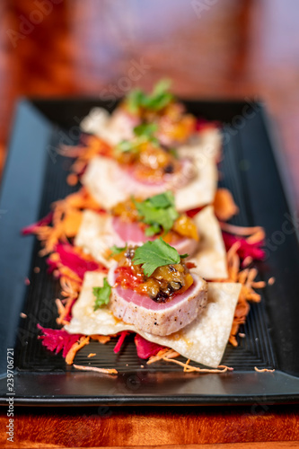 Seared Ahi Tuna Sashimi Appetizer on Wonton Crisp photo