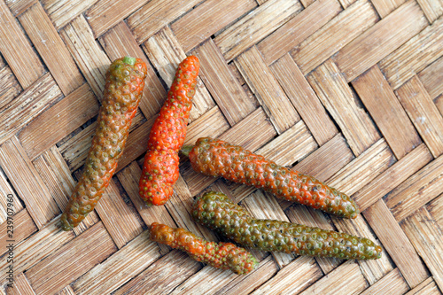 Diadi Long pepper in bamboo basket, Long pepper, Indian long pepper, Javanese long pepper, Piper chaba Hunt (Piperaceae), Diade herbs photo