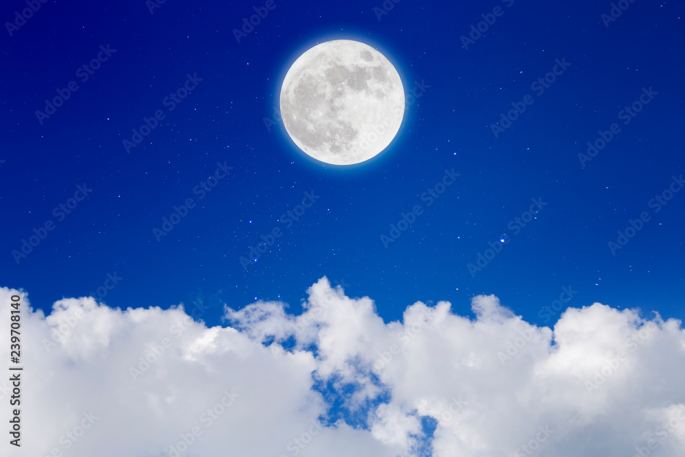 Romantic night with full moon in space over stars with cloudscape background.