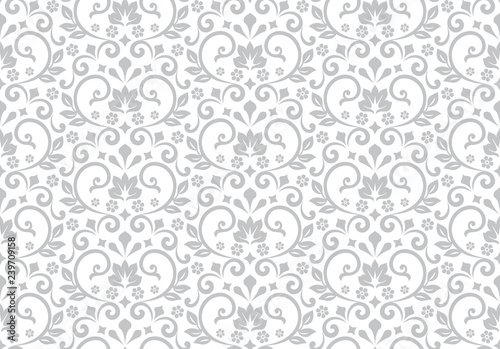 Wallpaper in the style of Baroque. Seamless vector background. White and grey floral ornament. Graphic pattern for fabric, wallpaper, packaging. Ornate Damask flower ornament.