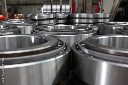 Manufacture of bearings in the factory.The chrome surface of products. Industrial theme. Production of bearings.