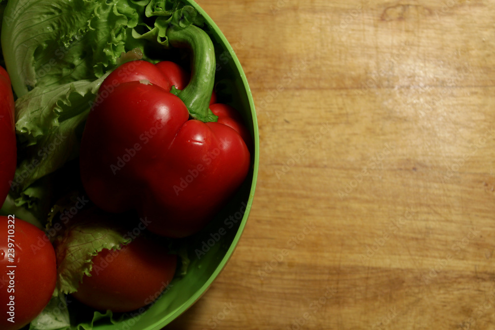 Salad in bowl on wood Salad in bowl on wood