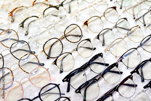 Glasses, Eyeglasses Optical Store, Fashion eyewear at night market, Colorful glasses, Glasses on shelf, Glasses in optical store shopping mall (Selective Focus) photo