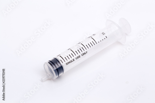 Closed up syringe on isolated background.