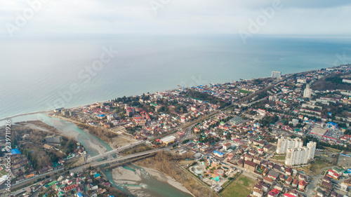 Lasarevskoye, Sochi. Winter. Aerial view of a coastal town in mountains photo