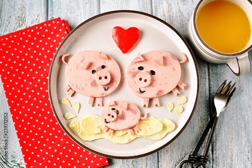 Cute family of pigs food art idea for children's breakfast. symbol of 2019, Top view. 