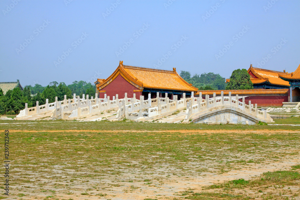 Fototapeta premium White marble stone bridge and glazed tile roof