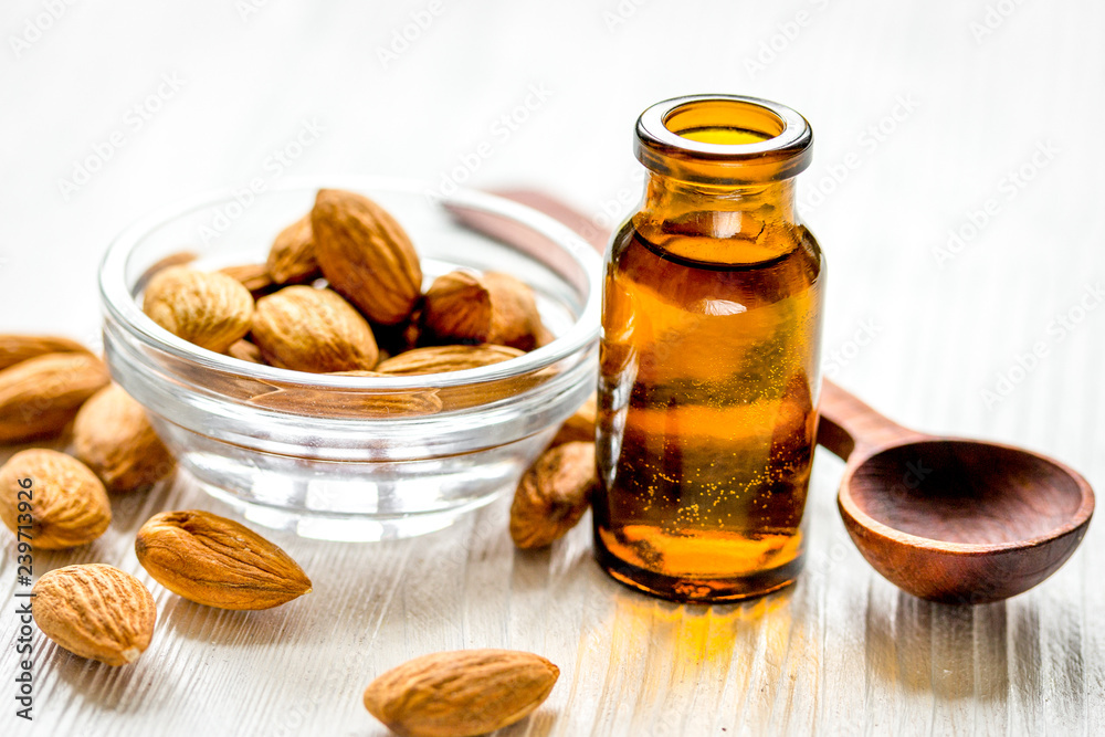 spa with almond oil in organic cosmetic set on white background spa with almond oil in organic cosmetic set on white background