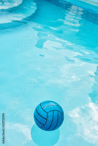Vertical image of blue ball in blue pool © Olha