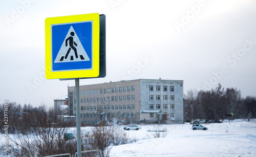 Road signs on street poles pedestrian crossing sign