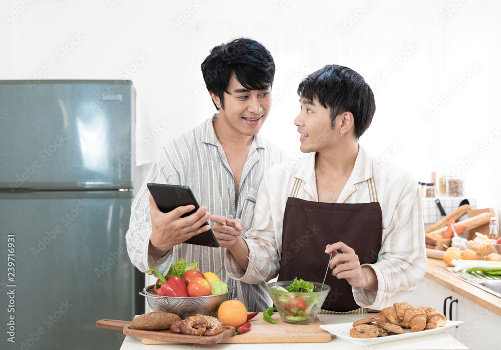 Sweet gay couple preparing food