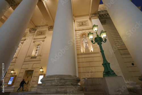 Moscow street in the december.  Image of the Bolshoi Theater at night.