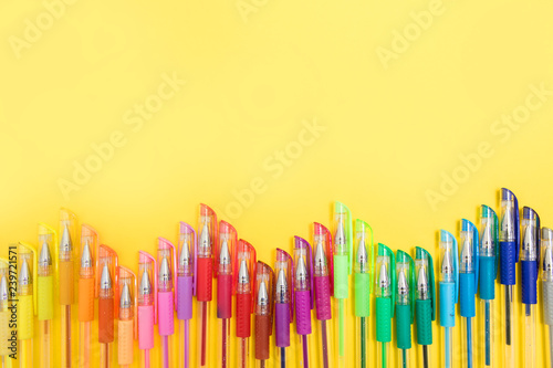 colored felt-tip pens on a pastel colored background photo