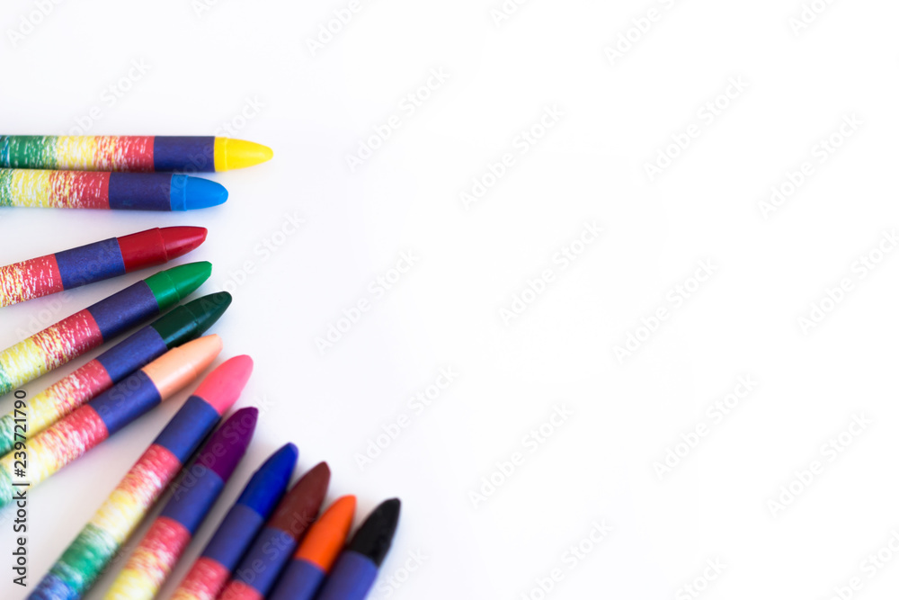 Colored wax pencils on a white background close-up Colored wax pencils on a white background close-up