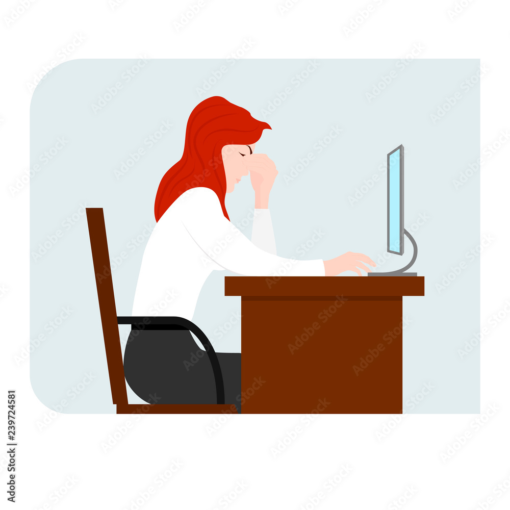 Girl is sitting in front of the computer and holding her head. Point of pain. Computer fatigue