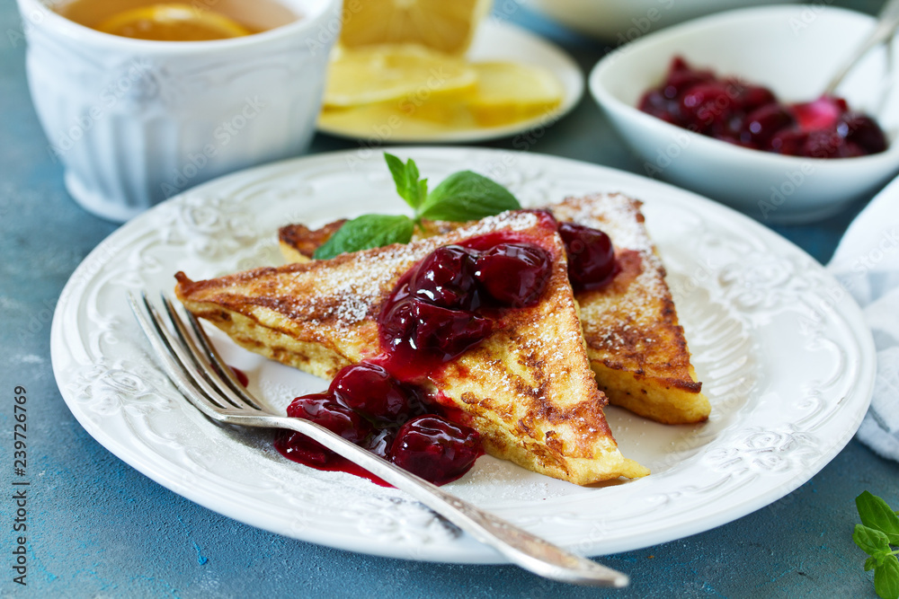 French toast with cherry sauce. French toast with cherry sauce.