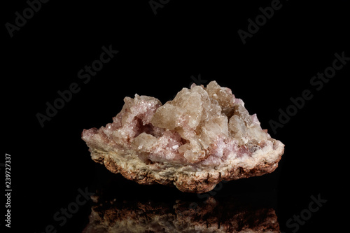 Macro mineral stone Pink Amethyst on a black background