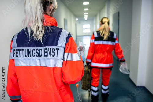German paramedic runs in a floor to an accident