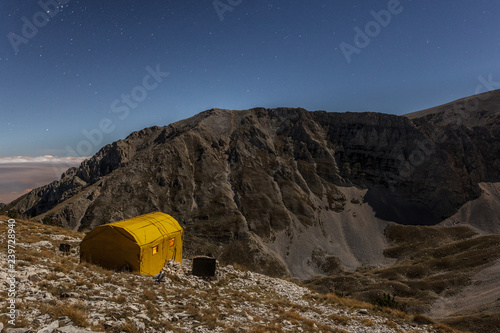 Carlo Fusco hut and the amphitheater of the Murelle at moonlight, Majella national park, Abruzzo, Italy, Europe photo