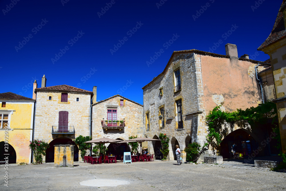 Architecture in the central square of the medieval bastide village of Monpazier in the Dordogne region of France