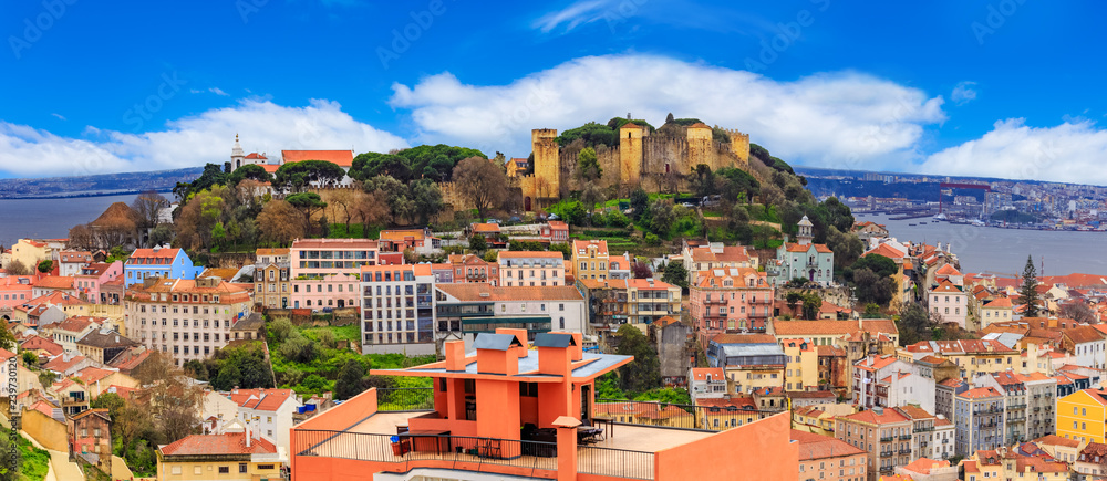 Panorama of Lisbon, cityscape and famous Sao Jorge castle in a day time, in Portugal