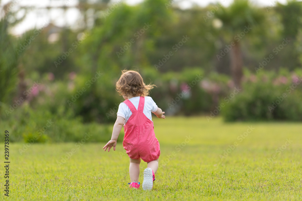 little girl spending time at backyard little girl spending time at backyard