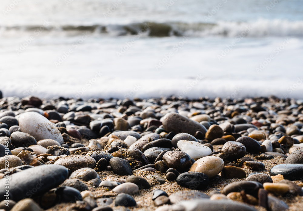 Pebble beach and blue sky on background