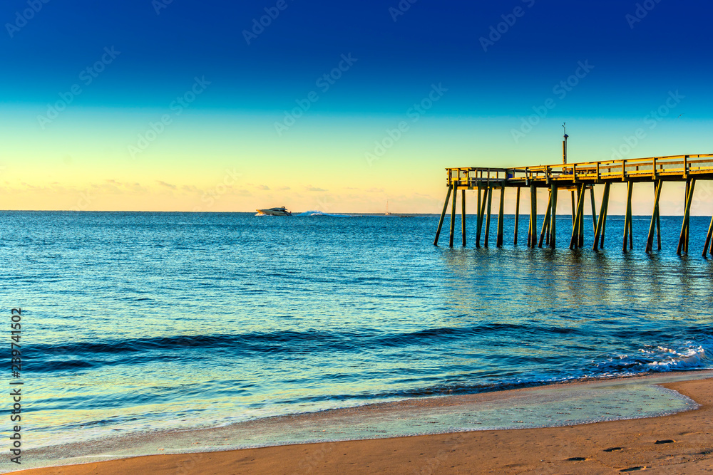 motor boat on ocean at sunrise