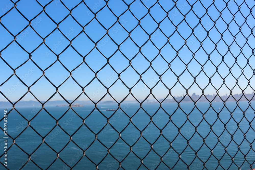 wire mesh and background, sea and city wire mesh and background, sea and city