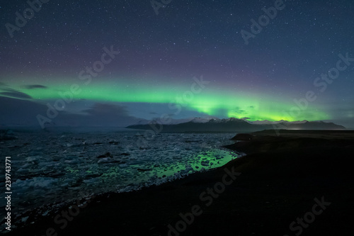 Aurora Boreal over Jokulsarlon lagoon in Iceland © aruizhu