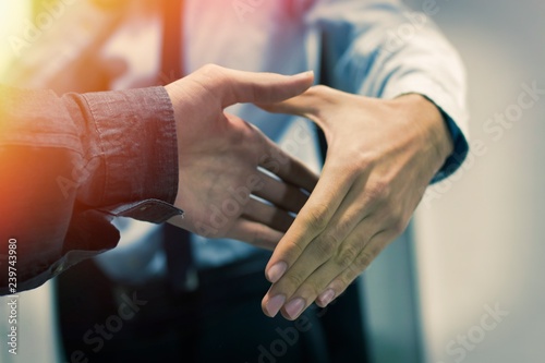 greeting and agreement of the hands of business people