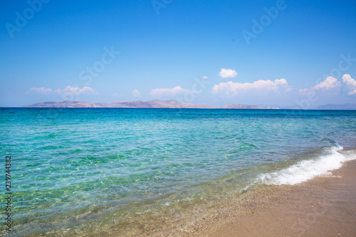 Fototapeta Naklejka Na Ścianę i Meble -  Sea coast and blue turquoise water. Blue sunny sky, summertime.