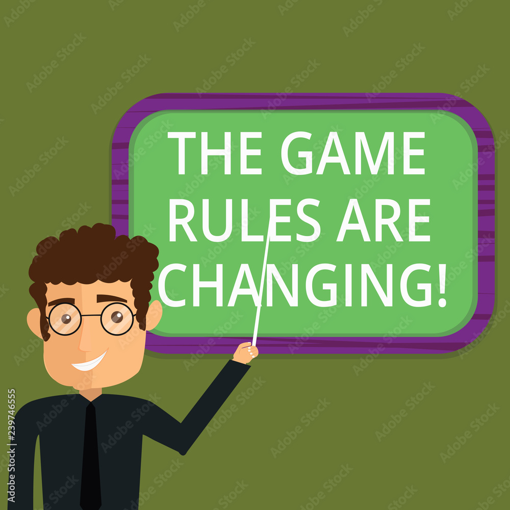 Writing note showing The Game Rules Are Changing. Business photo showcasing Changes in established competition agreements Man Standing Holding Stick Pointing to Wall Mounted Blank Color Board Writing note showing The Game Rules Are Changing. Business photo showcasing Changes in established competition agreements Man Standing Holding Stick Pointing to Wall Mounted Blank Color Board