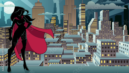 Silhouette superheroine standing tall against city background.