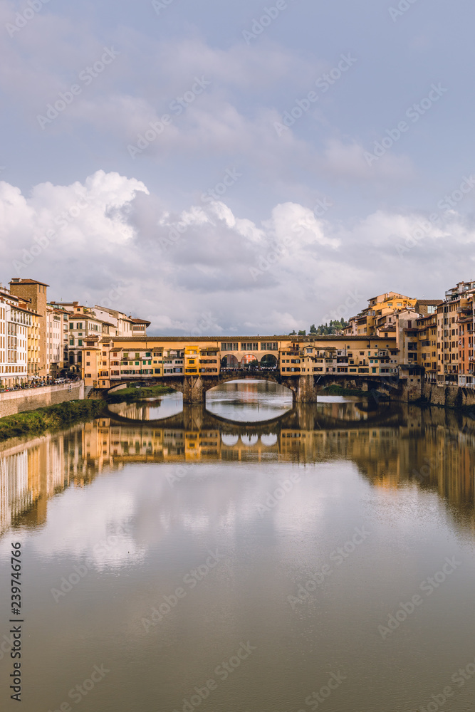 View of Ponte Vecchio in Florence (Firenze) in a cloudy day. Beautiful landscape of Florencia, Italy.