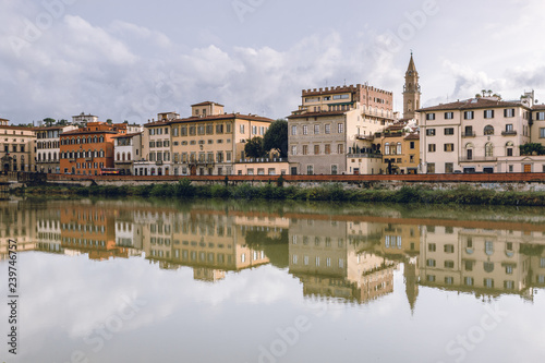 Old buildings reflecting in the Arno River in Florence. Travel destination in Italy  Europe.