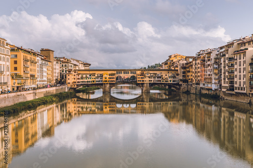 View of Ponte Vecchio in Florence  Firenze  in a cloudy day. Beautiful landscape of Florencia  Italy.