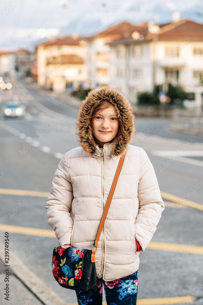 Outdoor portrait of cute little girl wearing warm winter jacket, image  taken in Lausanne, Switzerland Stock Photo | Adobe Stock