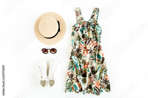 Woman summer clothes travel, collage on white background. Sundress-dress, straw hat, sneakers, sunglasses. Top view, flat lay.