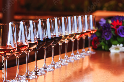 Wine glasses in a row. Buffet table celebration of wine tasting. Nightlife, celebration and entertainment concept
