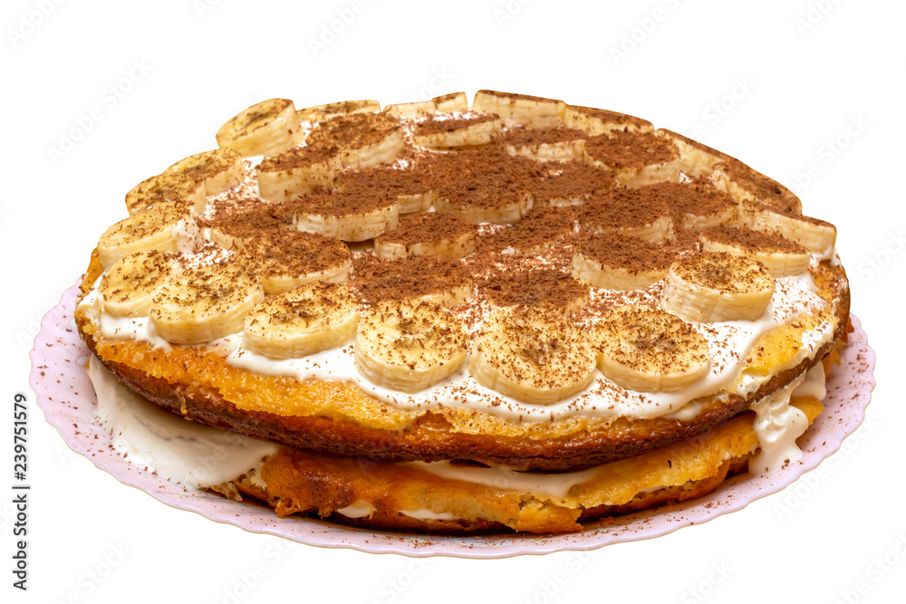 Sponge cake with banana slices and chocolate chips isolated on white background Sponge cake with banana slices and chocolate chips isolated on white background