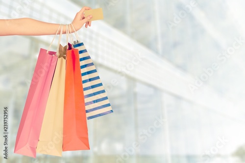 Woman hand with many shopping bag