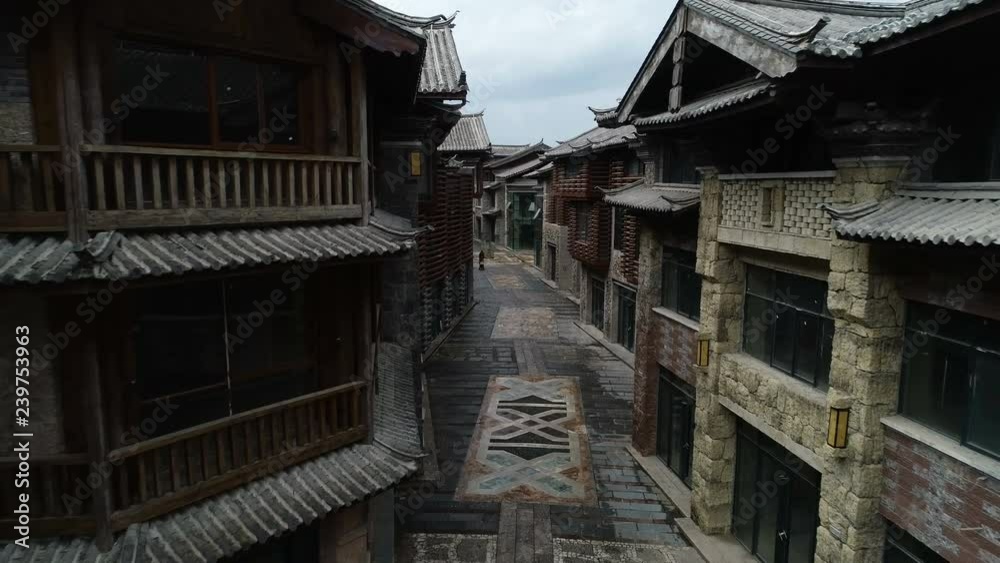 Slow drone shot through quiet shopping street, a prestigious project in the new town of Lijiang in China Slow drone shot through quiet shopping street, a prestigious project in the new town of Lijiang in China