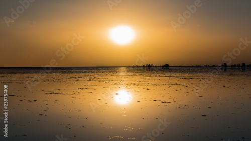 Fotografie Sunset in Salar de Uyuni Bolivia, the largest salt flat in the world