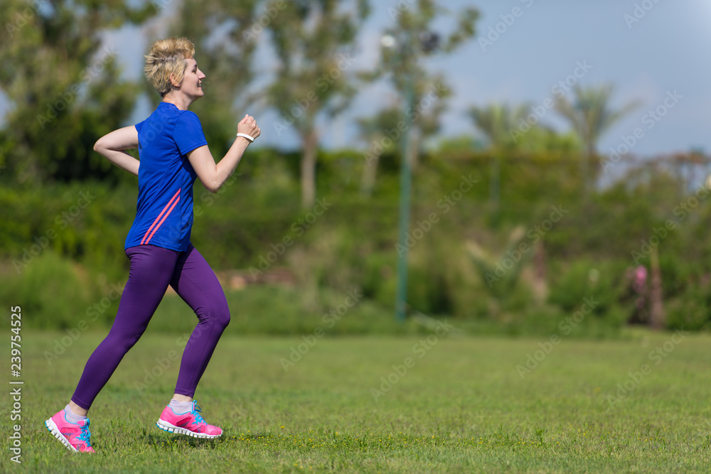 young female runner training for marathon