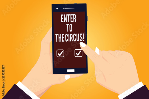 Word writing text Enter To The Circus. Business concept for Go to the show festival recreation entertainment Hu analysis Hands Holding Pointing Touching Smartphone Blank Color Screen